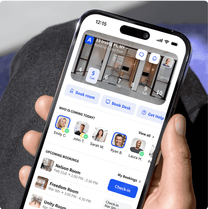 Person holding a phone with an Archie app showing upcoming workspace bookings.